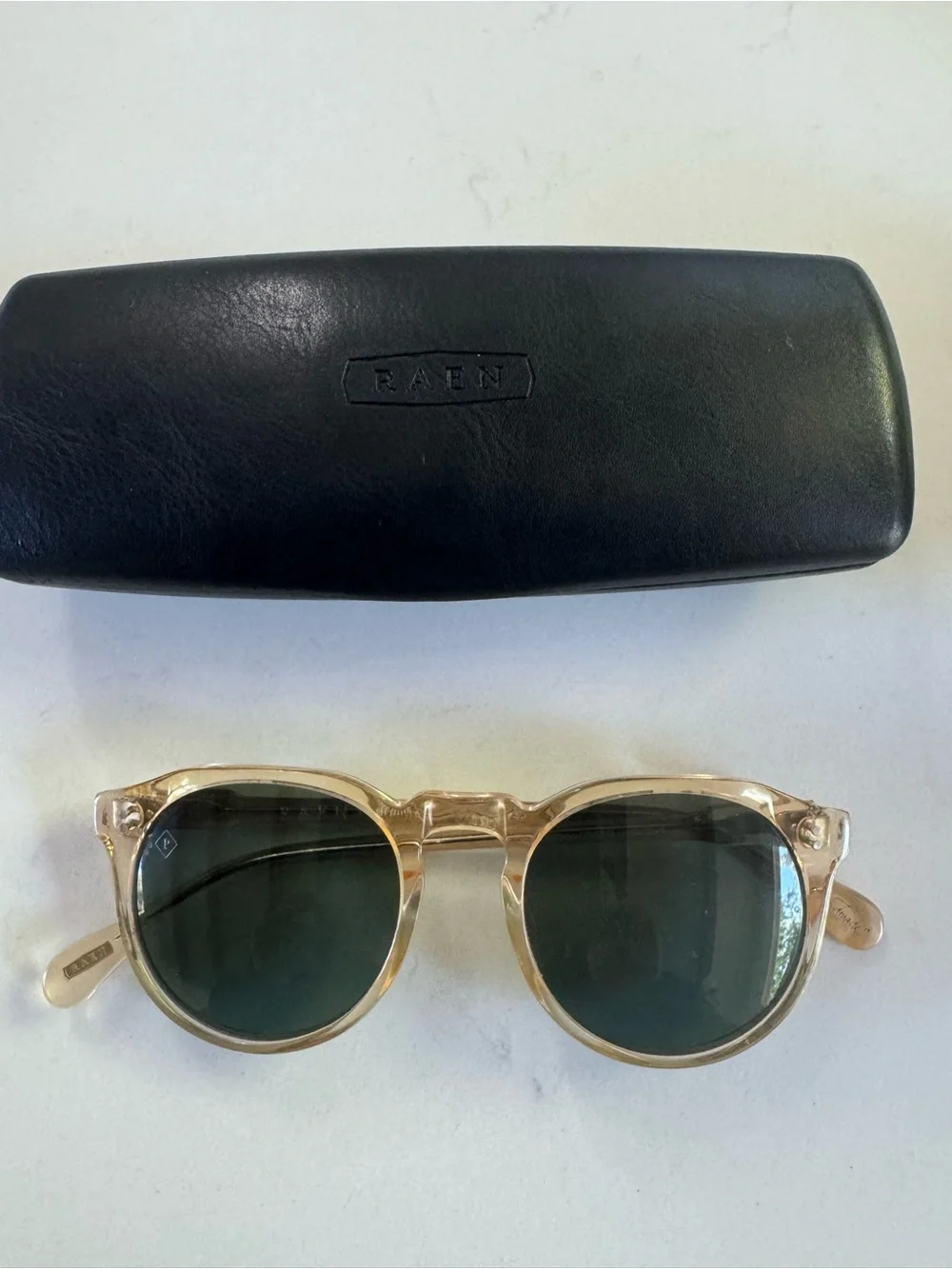 RAEN Remmy Sunglasses in champagne crystal with Dark Green Lenses